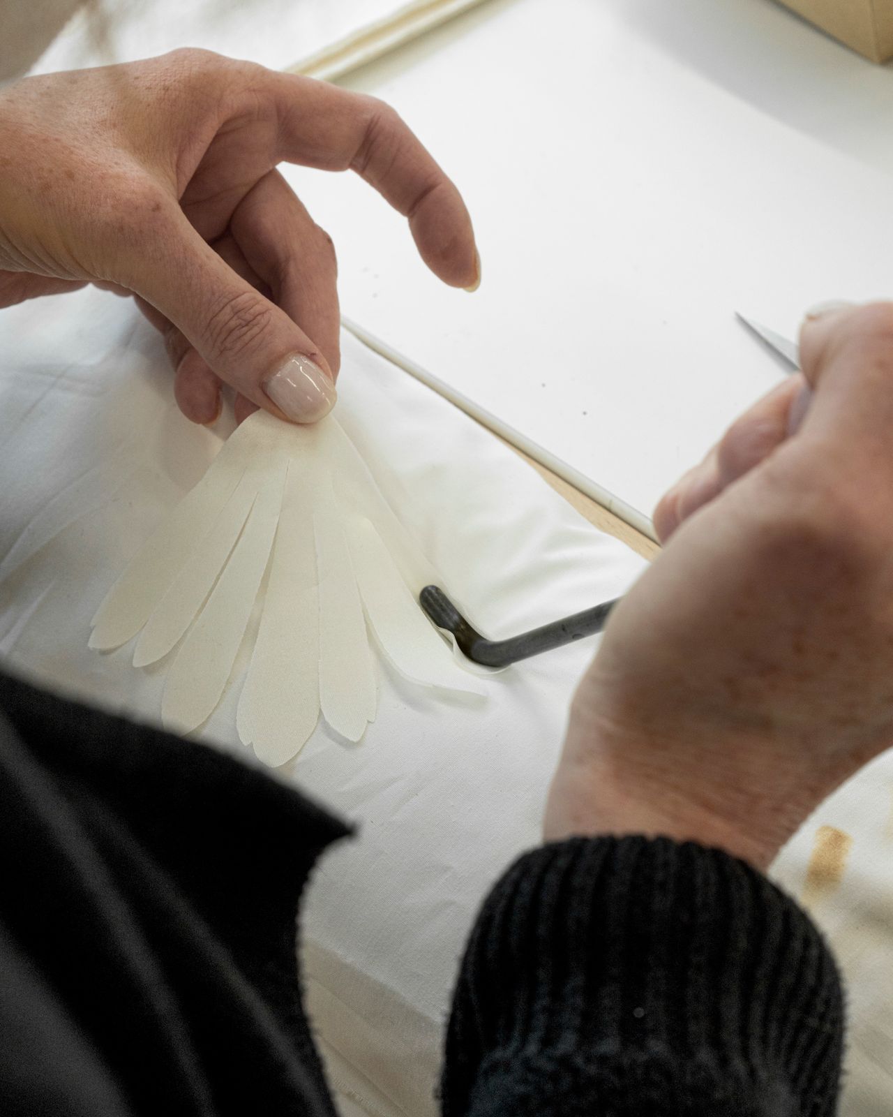 Lemarié — hand embossing a camellia petal with the ball tool